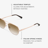 
Close-up of shiny rose gold aviator frames with brown gradient tinted lenses showing the adjustable temples and Italian spring hinges.