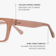 
Square champagne coloured eyeglasses with clear lenses.