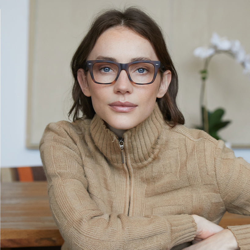 
Square tortoise glasses with clear lenses worn by a person