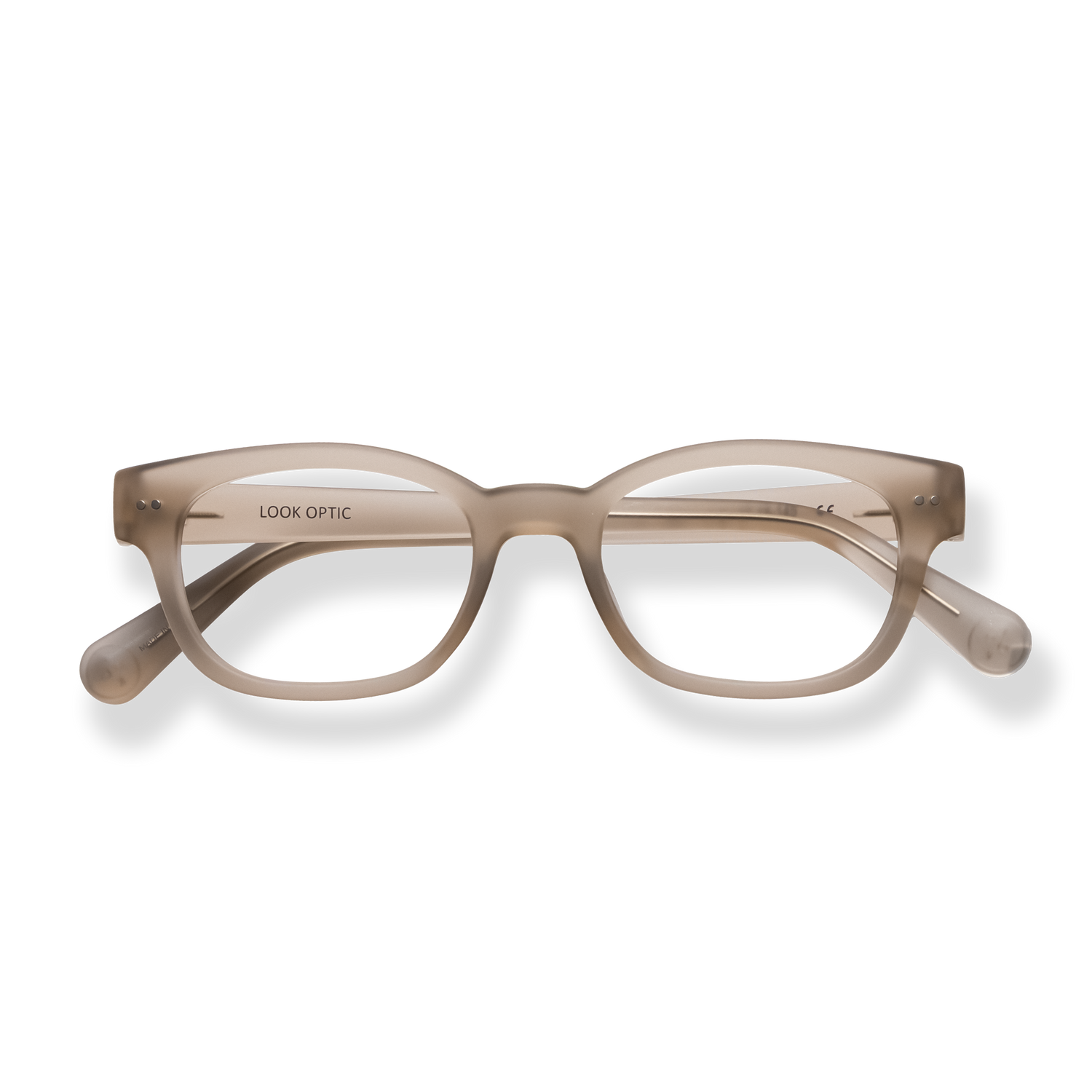 
Translucent beige rectangular eyeglasses with tortoiseshell arms and silver rivet details.