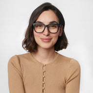 LA41PBLK10, LA41PBLK15, LA41PBLK20, LA41PBLK25, LA41PBLK30 - A person is wearing black square eyeglass frames with a glossy finish and lightly tinted lenses.