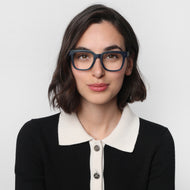 LA41PNAV10, LA41PNAV15, LA41PNAV20, LA41PNAV25, LA41PNAV30 - A person is wearing square navy glasses with a matte finish and clear lenses.