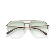 
Gold aviator sunglasses with pale green lenses and brown tortoiseshell temples.