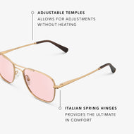 
Gold aviator-style eyeglasses with a double bridge and light pink tinted lenses, shown in a close angled view highlighting the adjustable temples and Italian spring hinges.