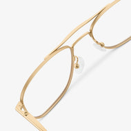 
Gold aviator-style eyeglasses with a double bridge and clear lenses, shown in a close rear angled view highlighting the double bridge and adjustable nose pads.