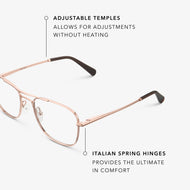 
Shiny rose gold aviator-style eyeglasses with a double bridge and clear lenses, shown in a close angled view highlighting the adjustable temples and Italian spring hinges.