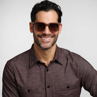 LA40XCHA10, LA40XCHA15, LA40XCHA20, LA40XCHA25 - A person wears square champagne brown frames with a glossy finish and dark brown tinted lenses.